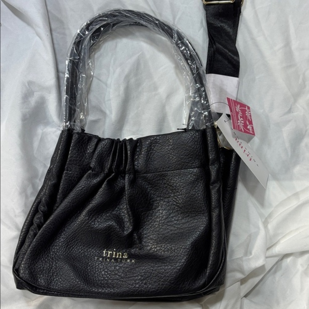 Trina Turk black vegan leather tote purse with webbing strap and coin purse